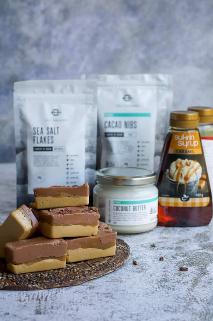 caramel bars and the ingredients used on a white backdrop