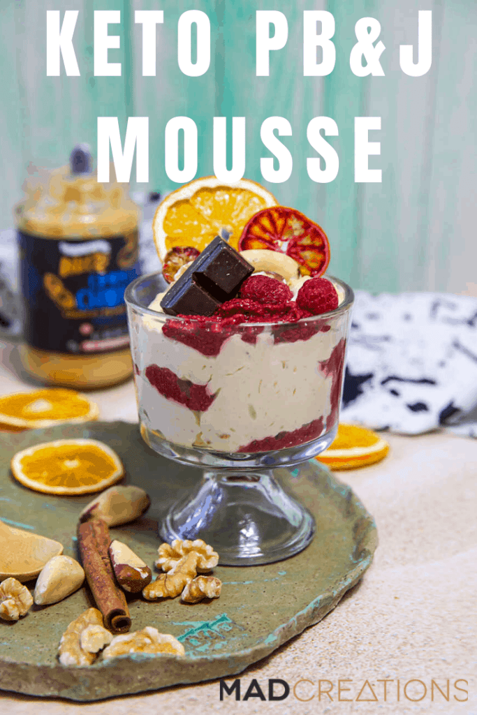 mousse with chocolate and berries in a small glass bowl