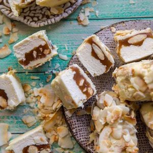 white chocolate snicker bars scattered on a wood background