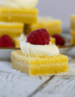 Lemon Bars with cream and raspberry