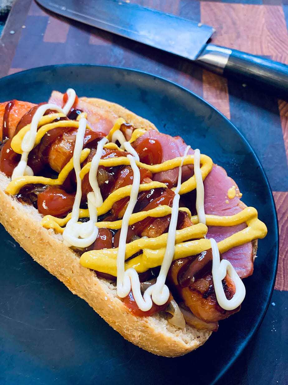 low carb hot dog on black plate
