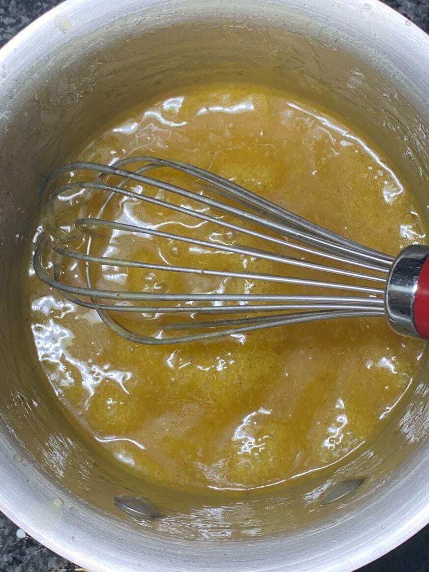 caramel in saucepan with whisk