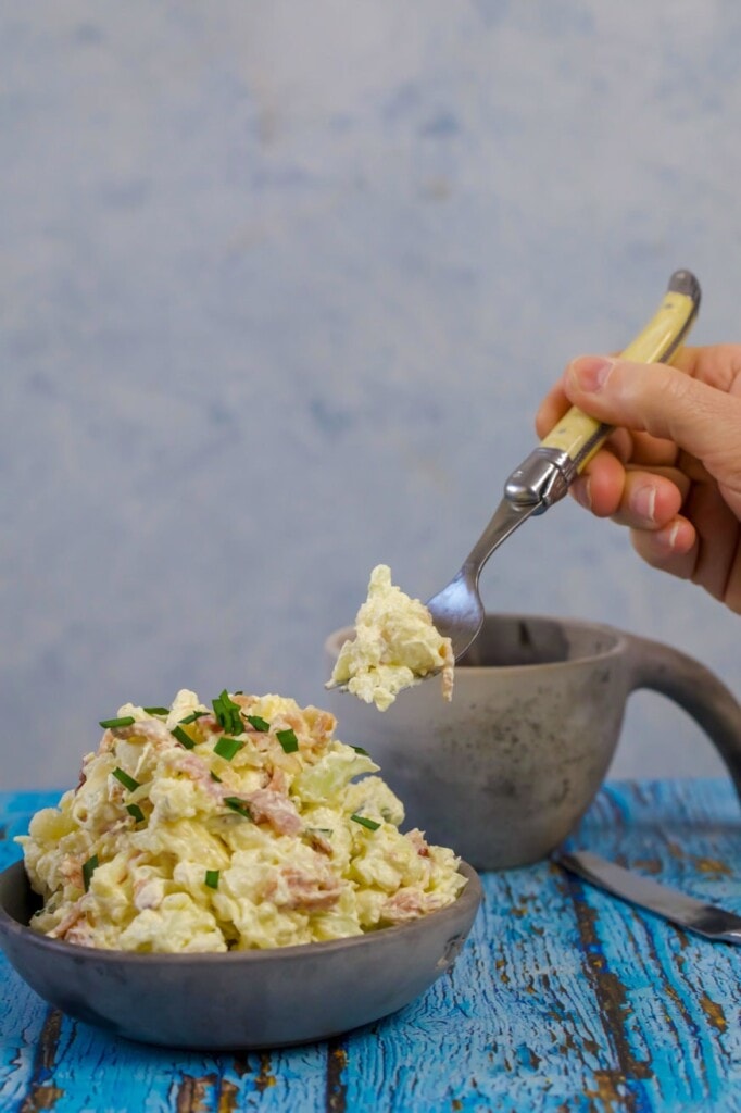A fork with cauliflower salad on it