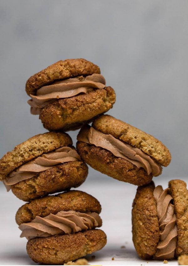 Stack of ginger cookies on white table