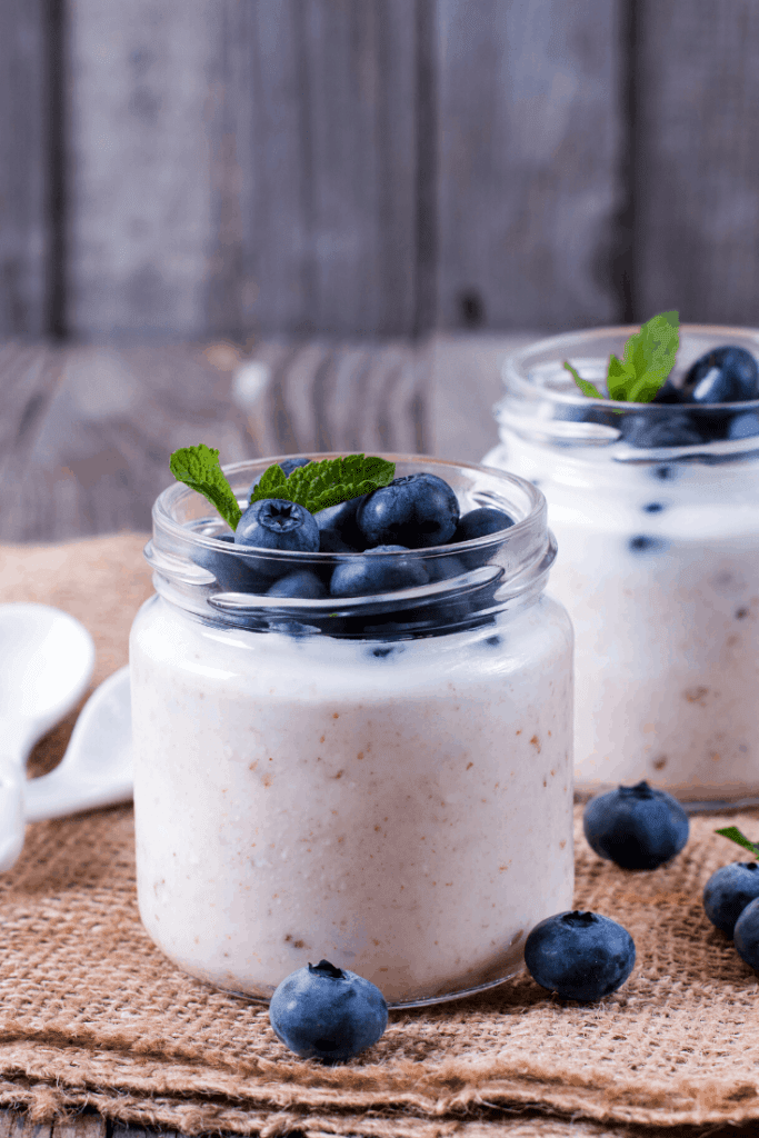 2 ingredient yoghurt in a glass jar with blueberries and mint