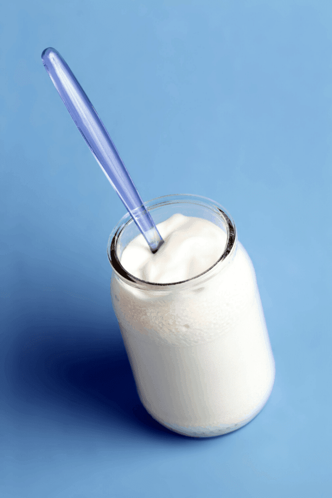 2 ingredient yoghurt in a glass jar with a spoon