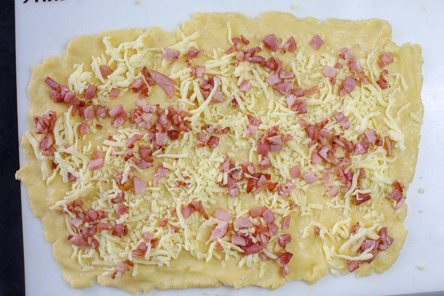 cheese and bacon on dough