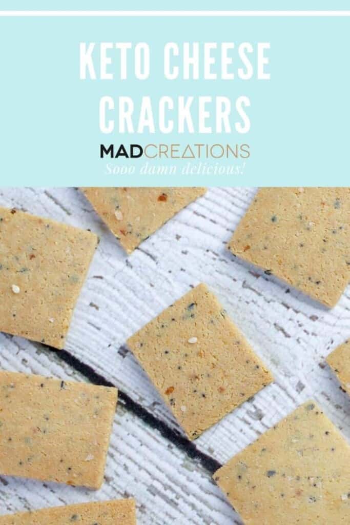 keto cheese crackers scattered on white wood