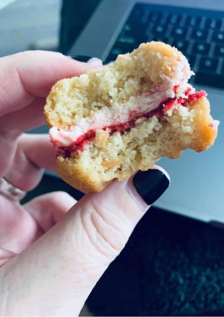 cookie with a bite out of it in a hand