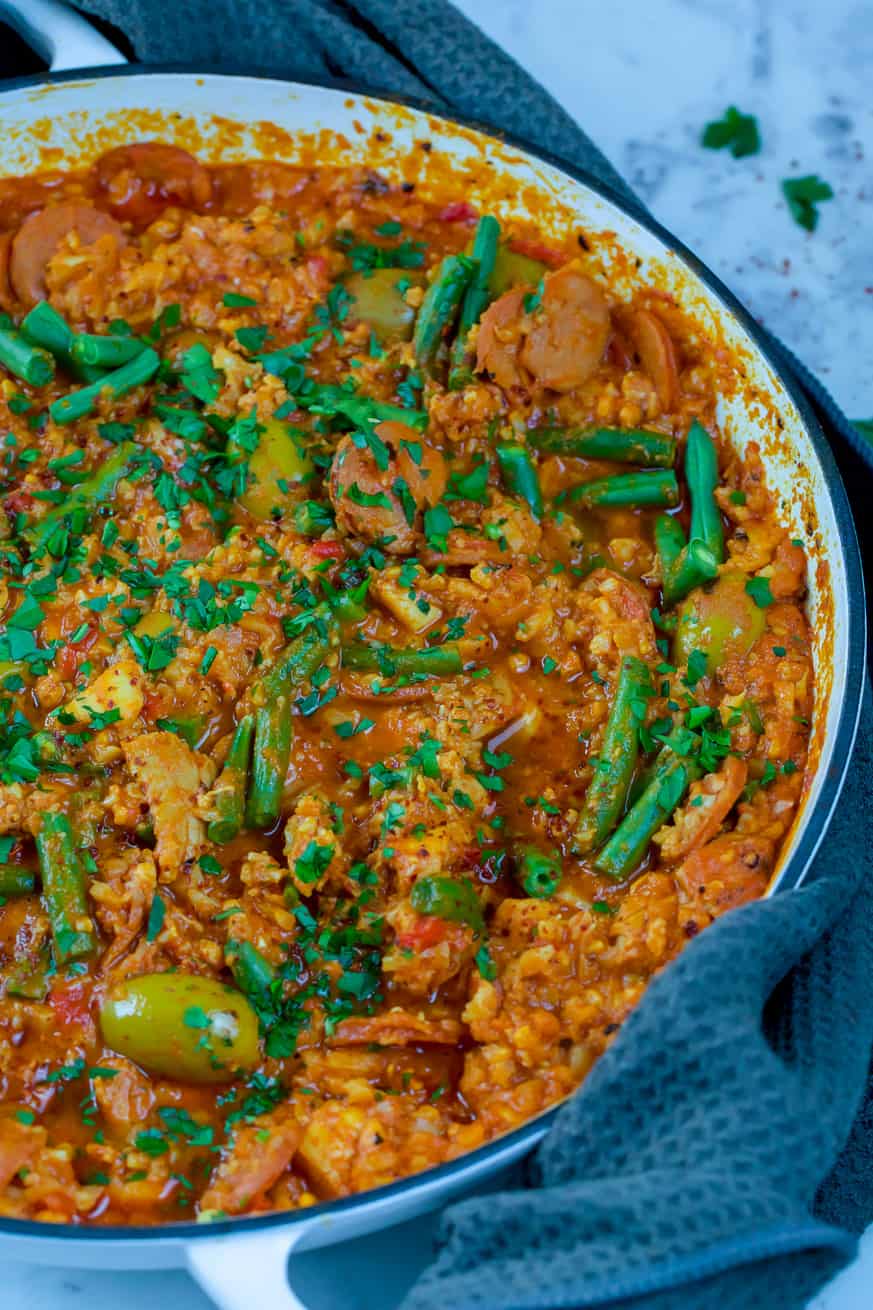 skillet filled with paella and green beans
