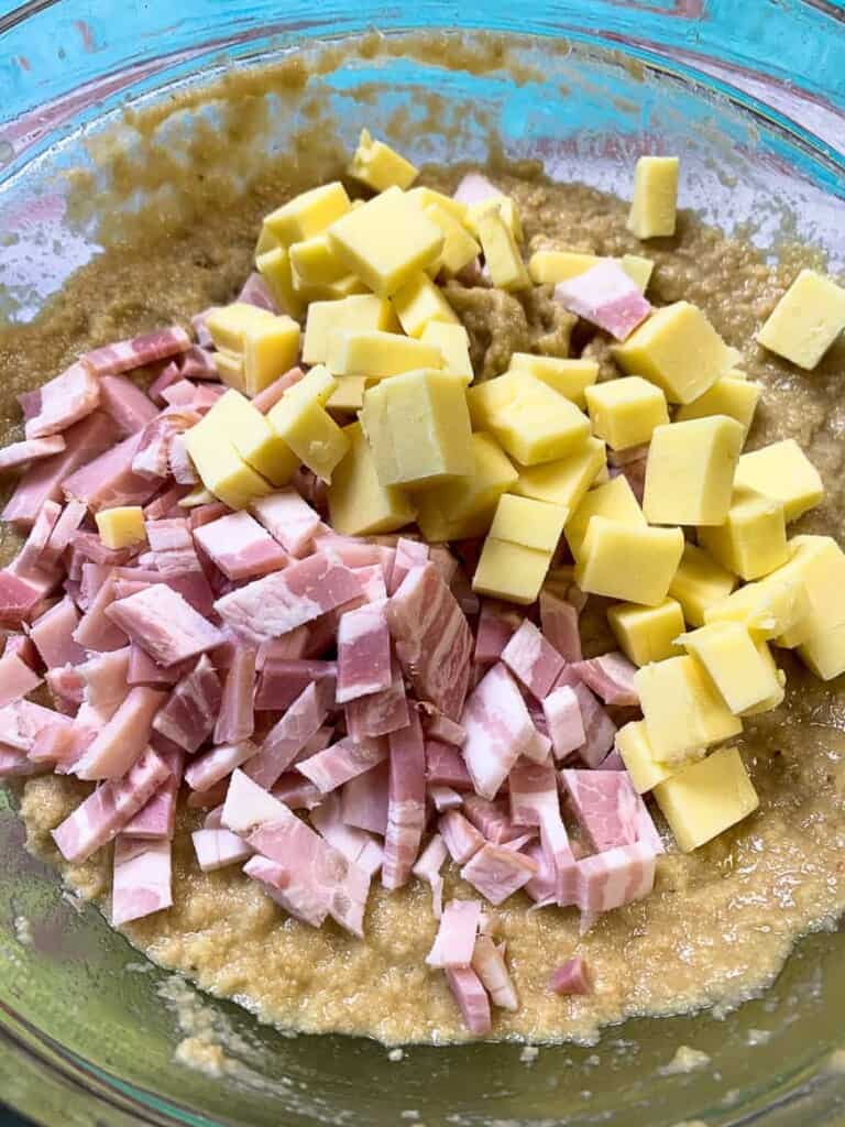 cubes of cheese and bacon with bread dough
