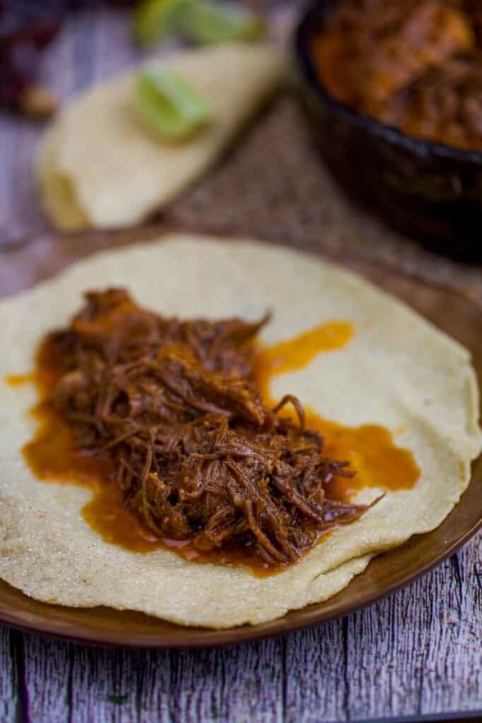 Instant Pot Mexican Shredded Beef on a tortilla