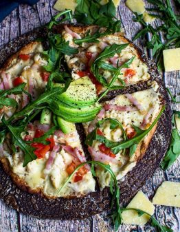 chicken pizza with rocket and avocado on top