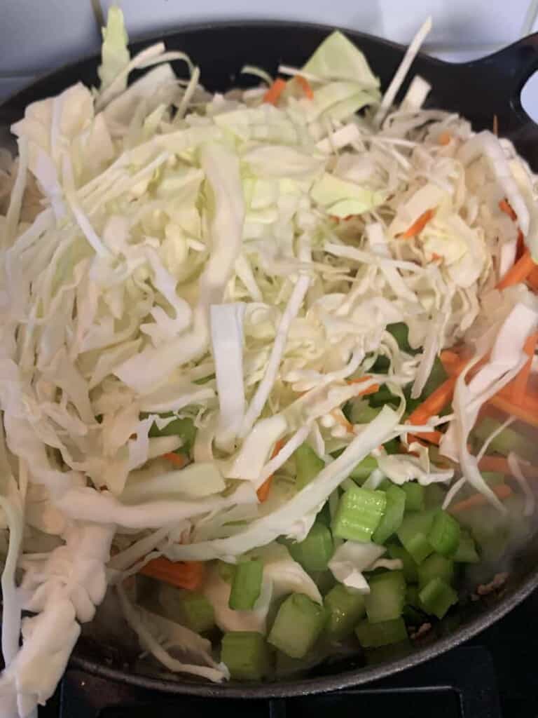 cabbage in a pan on top of a stirfry