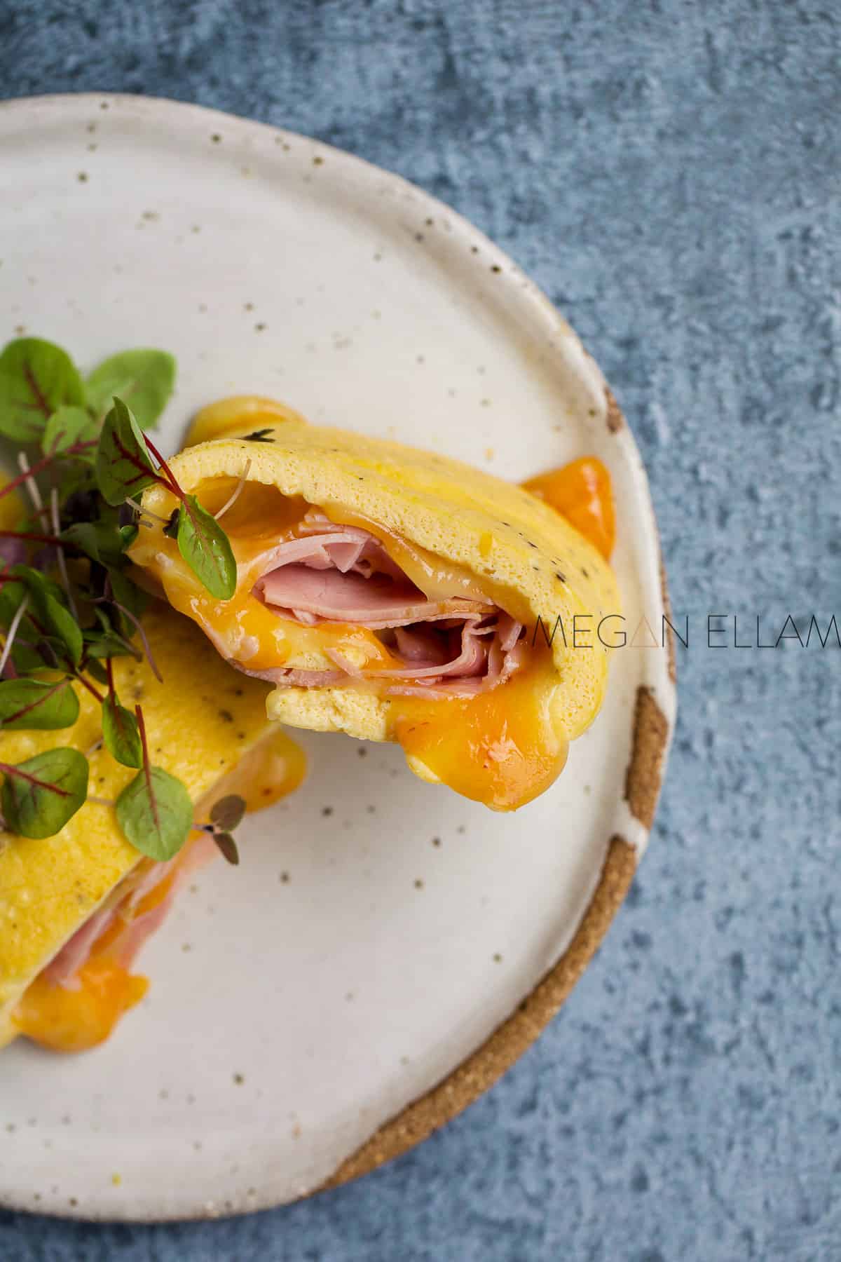 Ham and cheese omelette on a white plate