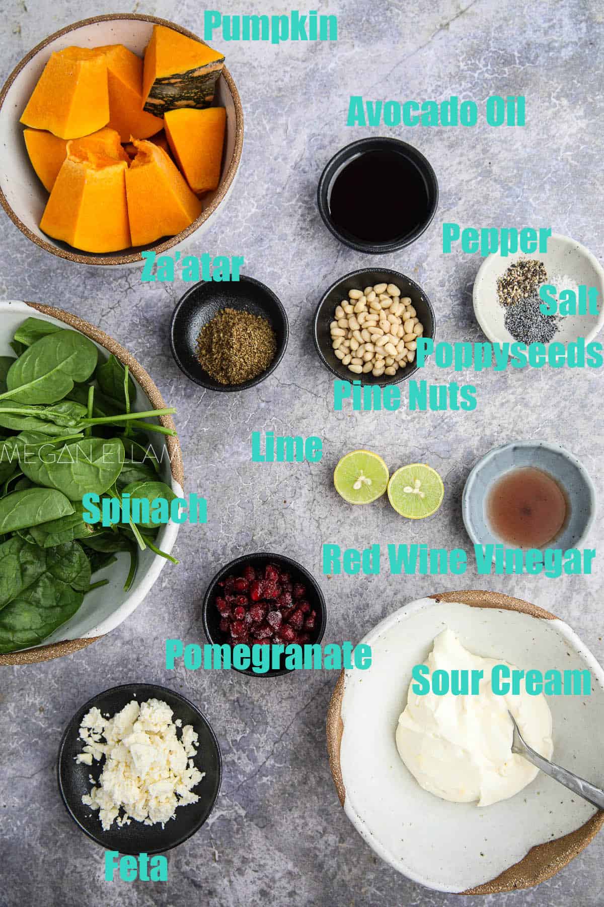 loads of small bowls of ingredients for a salad.