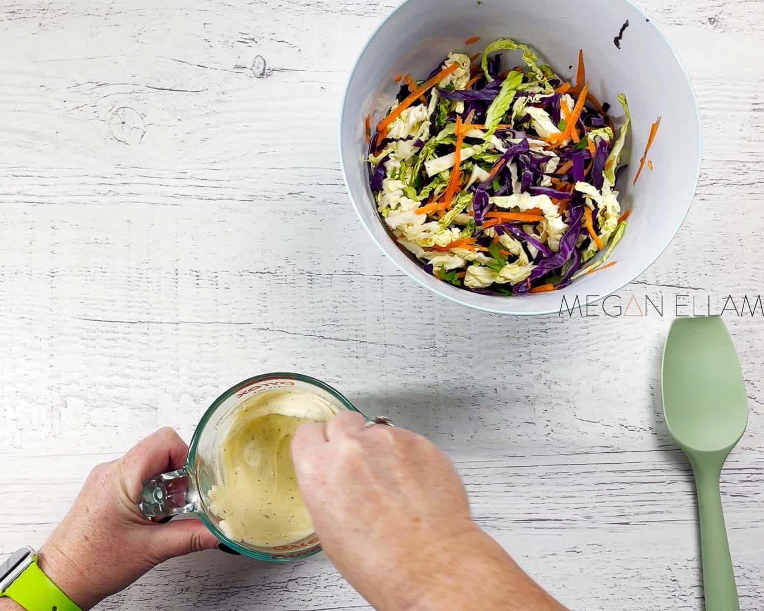 Mixing coleslaw dressing in a jug.