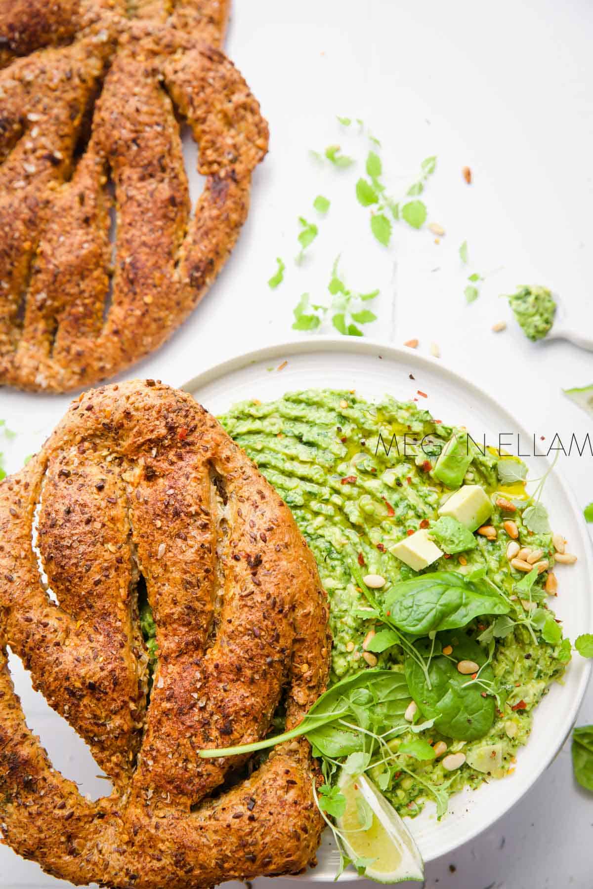 Low carb fougasse on a plate with avocado dip.