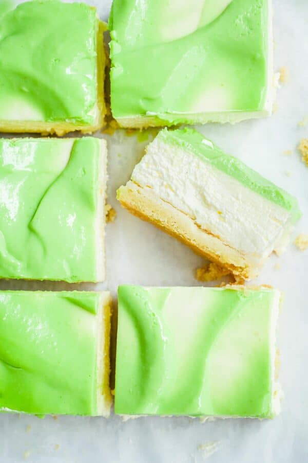A lime cheesecake cut into 6 pieces.