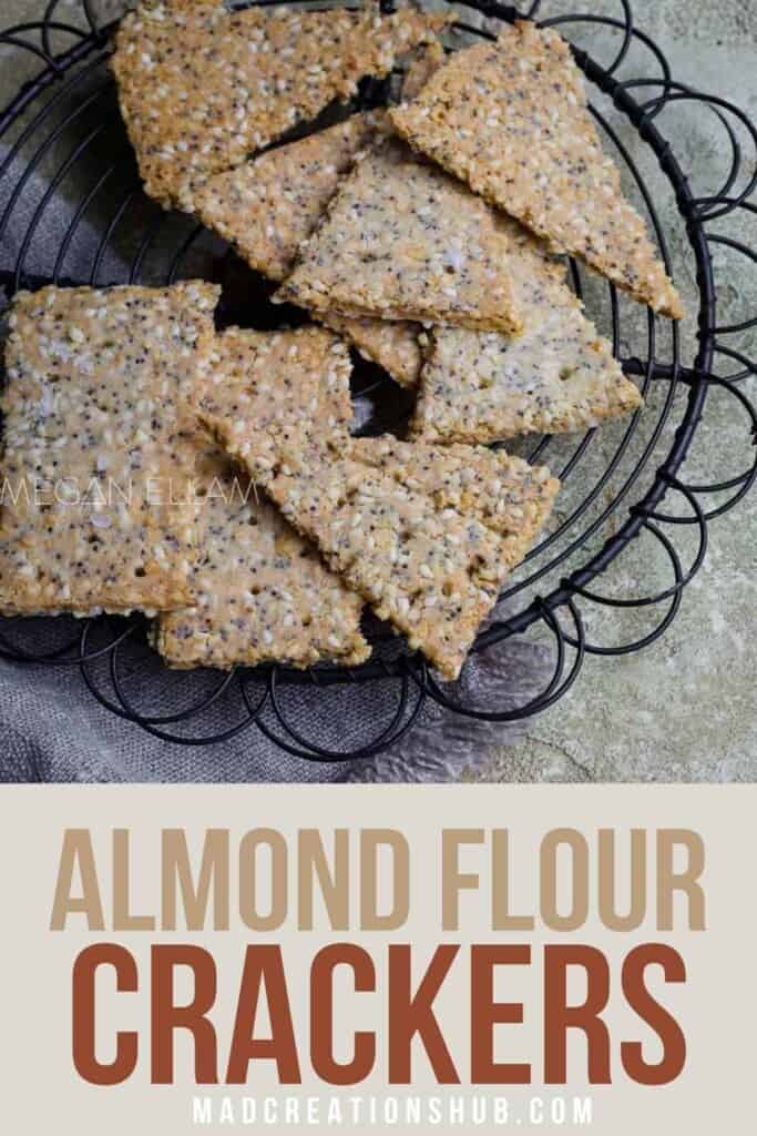 Almond Flour Crackers Pinterest Banner with crackers on a wire rack.