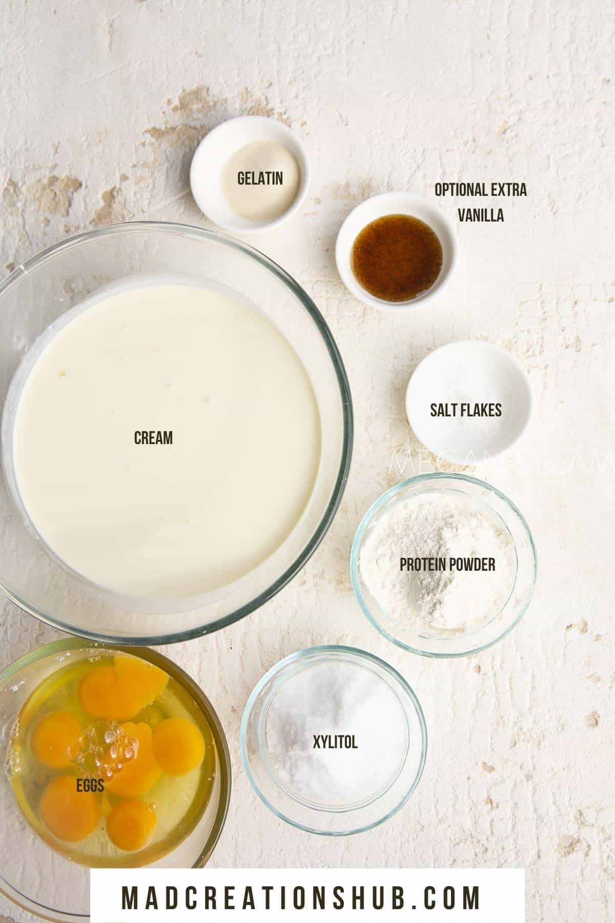 All the ingredients for ice cream bars in small bowls with the label for each ingredient.
