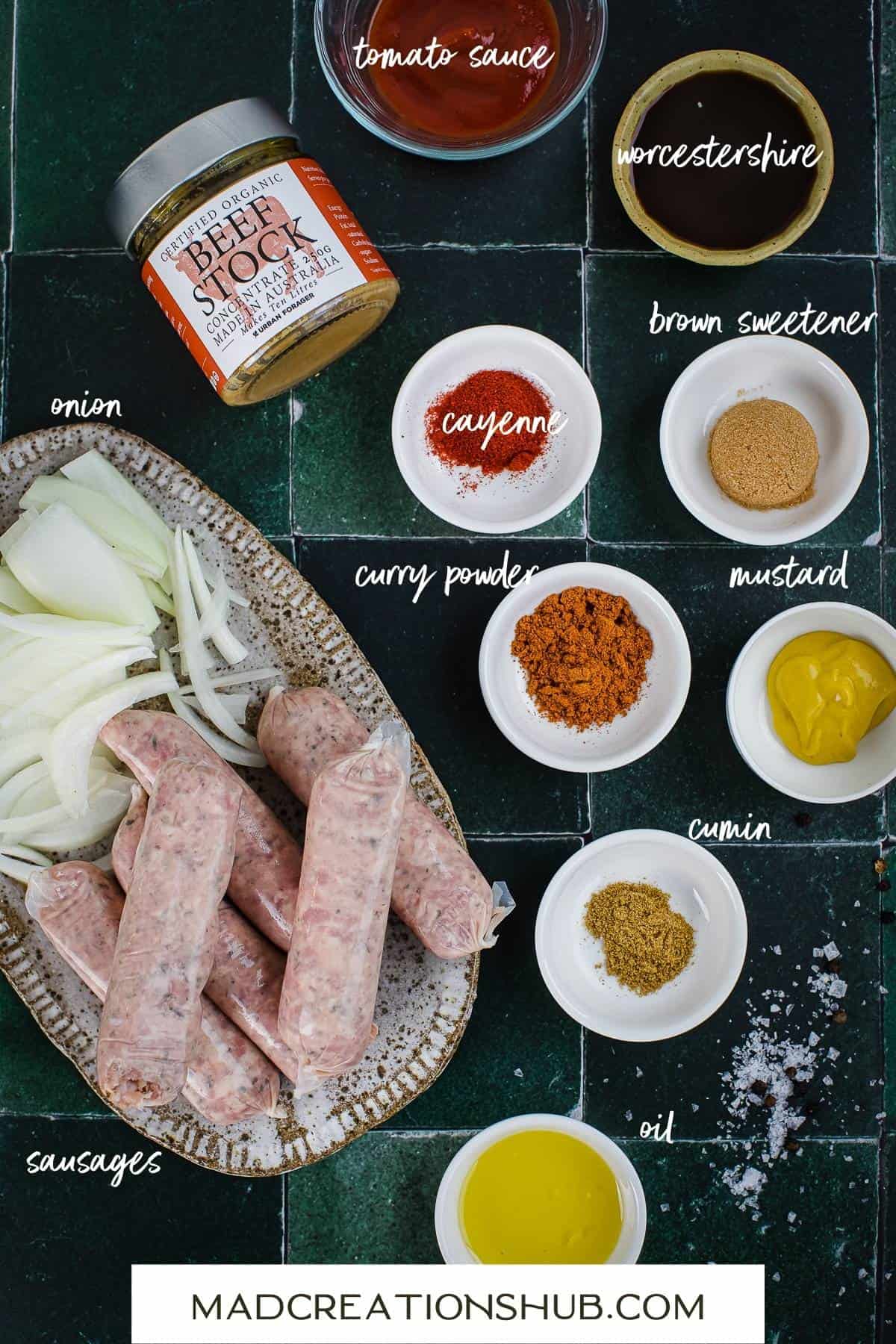Ingredients for devilled sausages in small bowls with labels to tell you what they are.