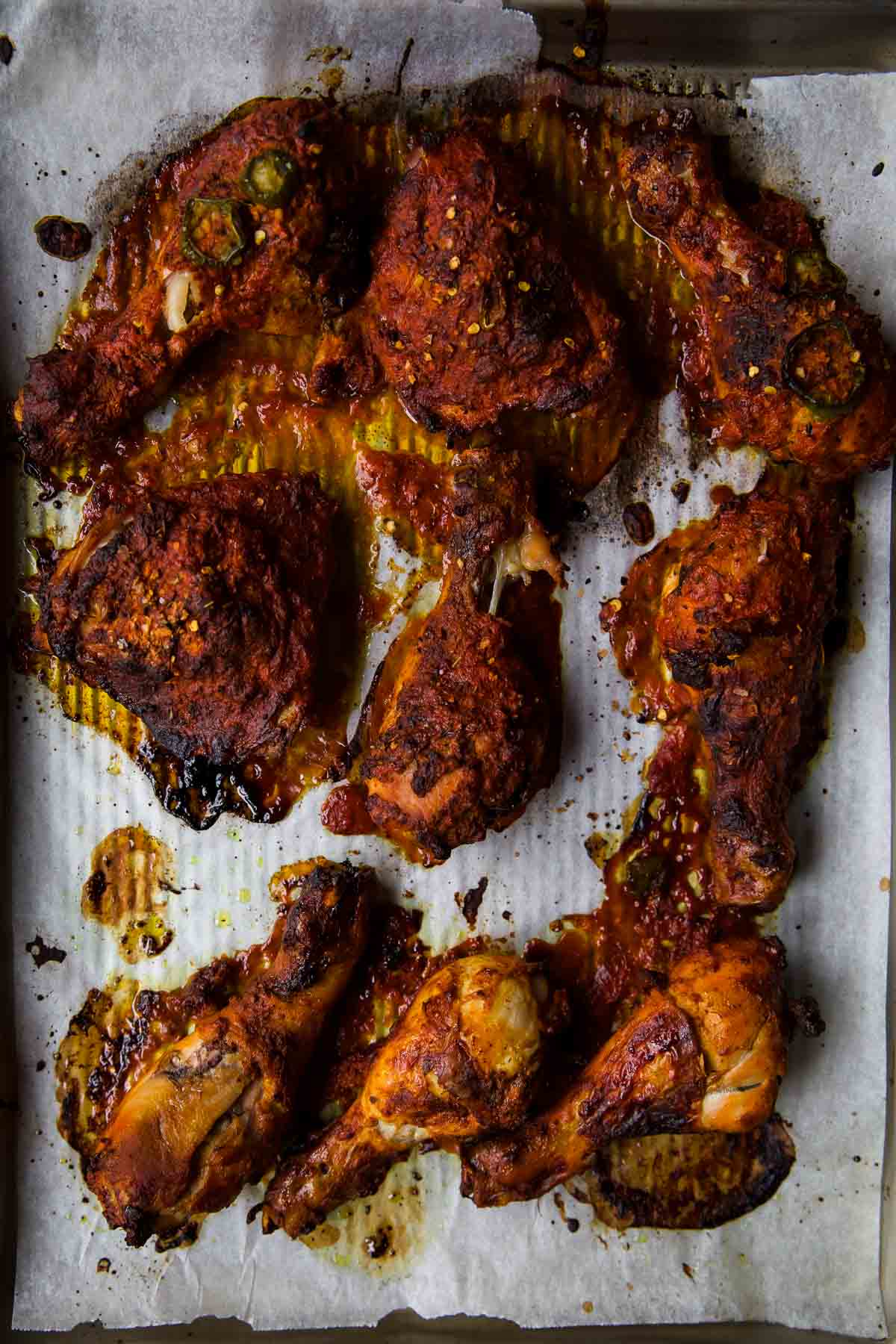 Baked Chicken in a tandoori marinade on a baking tray.