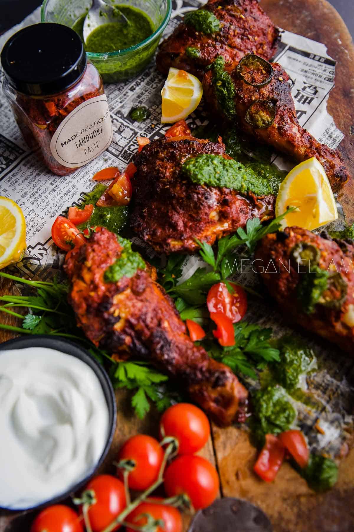 Pieces of chicken with herbs and lemon.