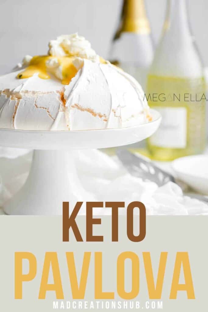 Keto Pavlova on a white cake stand on a Pinterest banner.