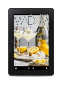 MADXM Celebrate eBook cover on a black tablet.