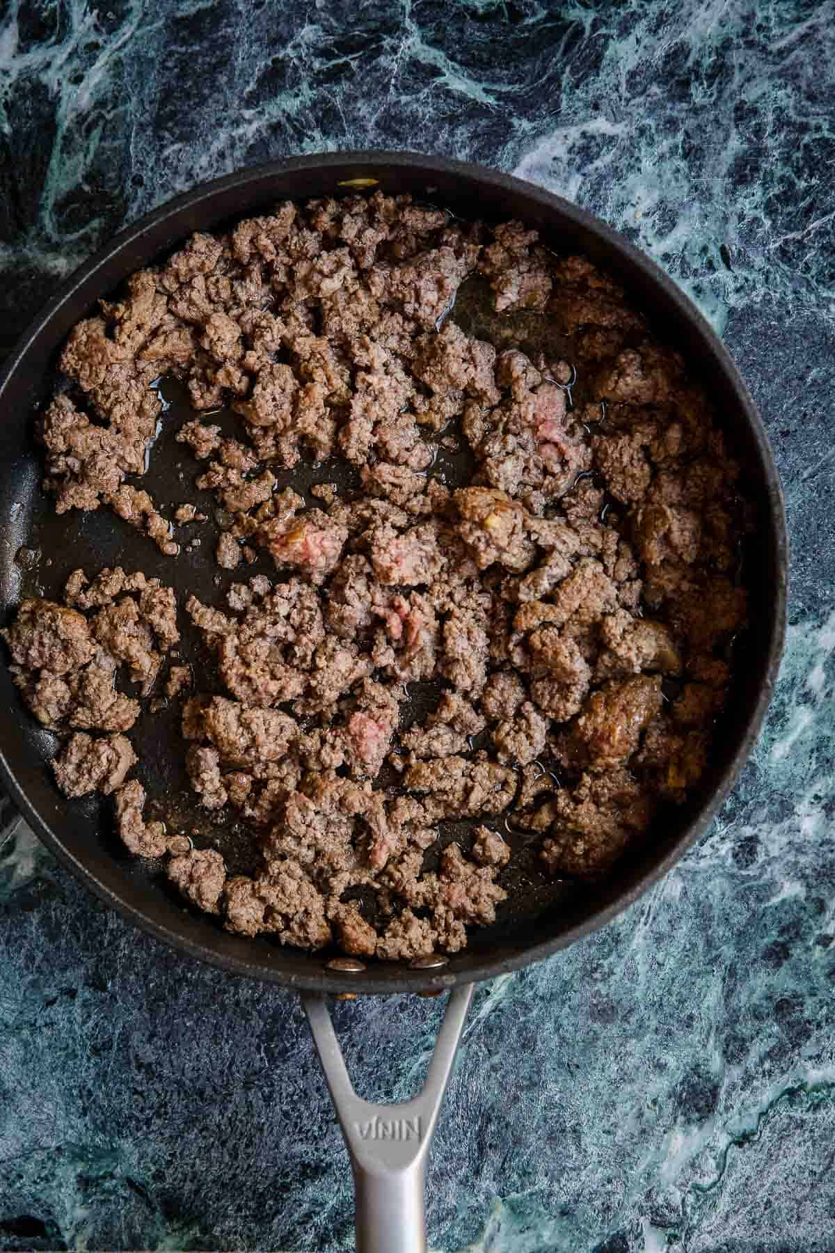 Browned beef mince in a frying pan.