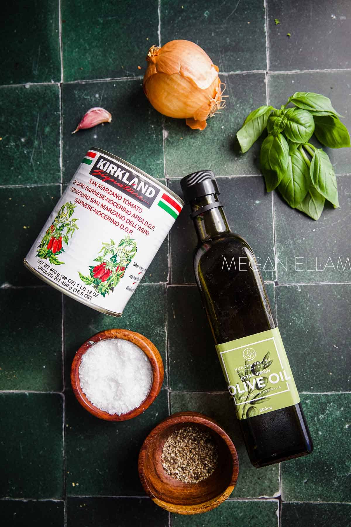 Ingredients for Napoli sauce on green tiles.