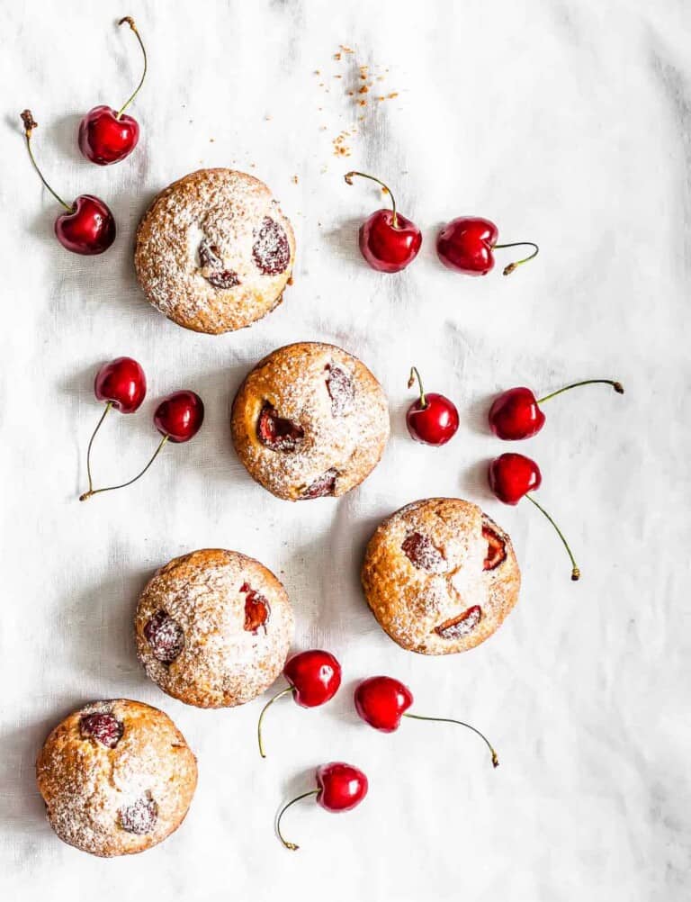 Keto Cherry Muffins on white linen.