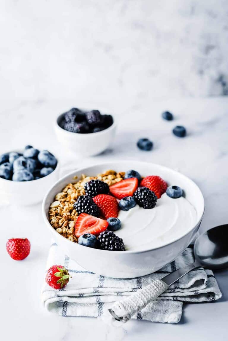 Yogurt Pots topped with berries and granola.