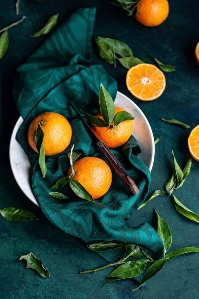Oranges with a green towel