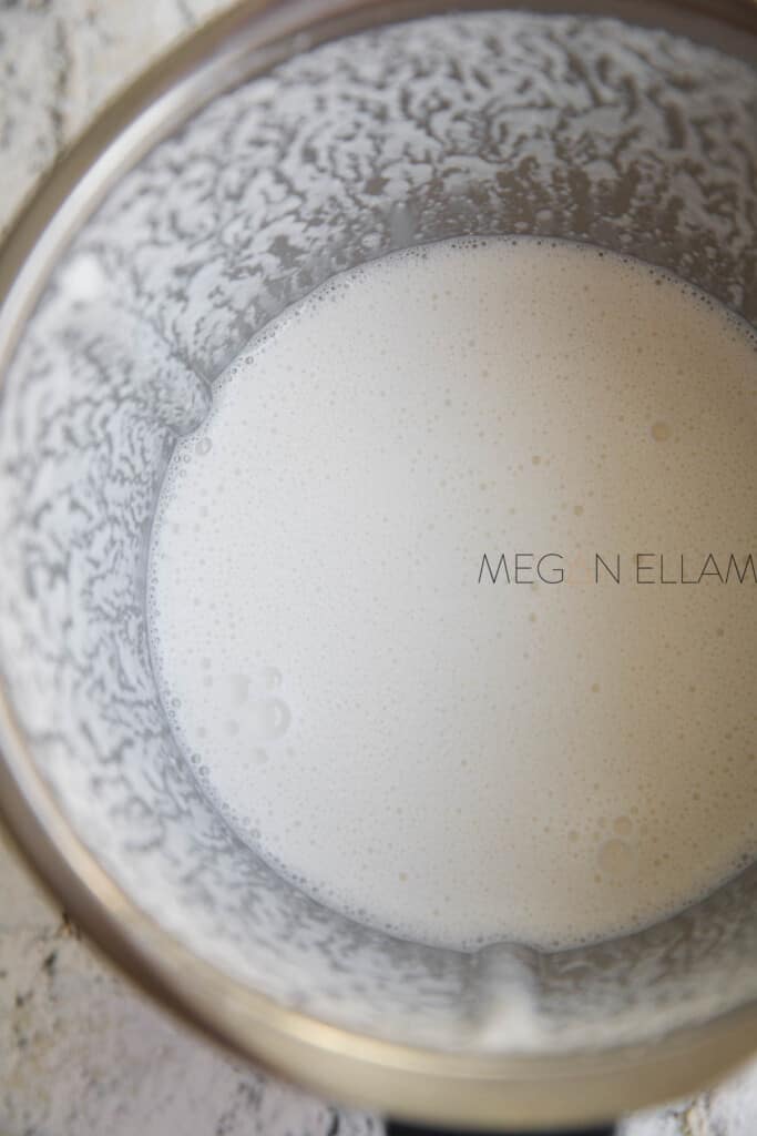 A Thermomix bowl with blended nut milk in it.