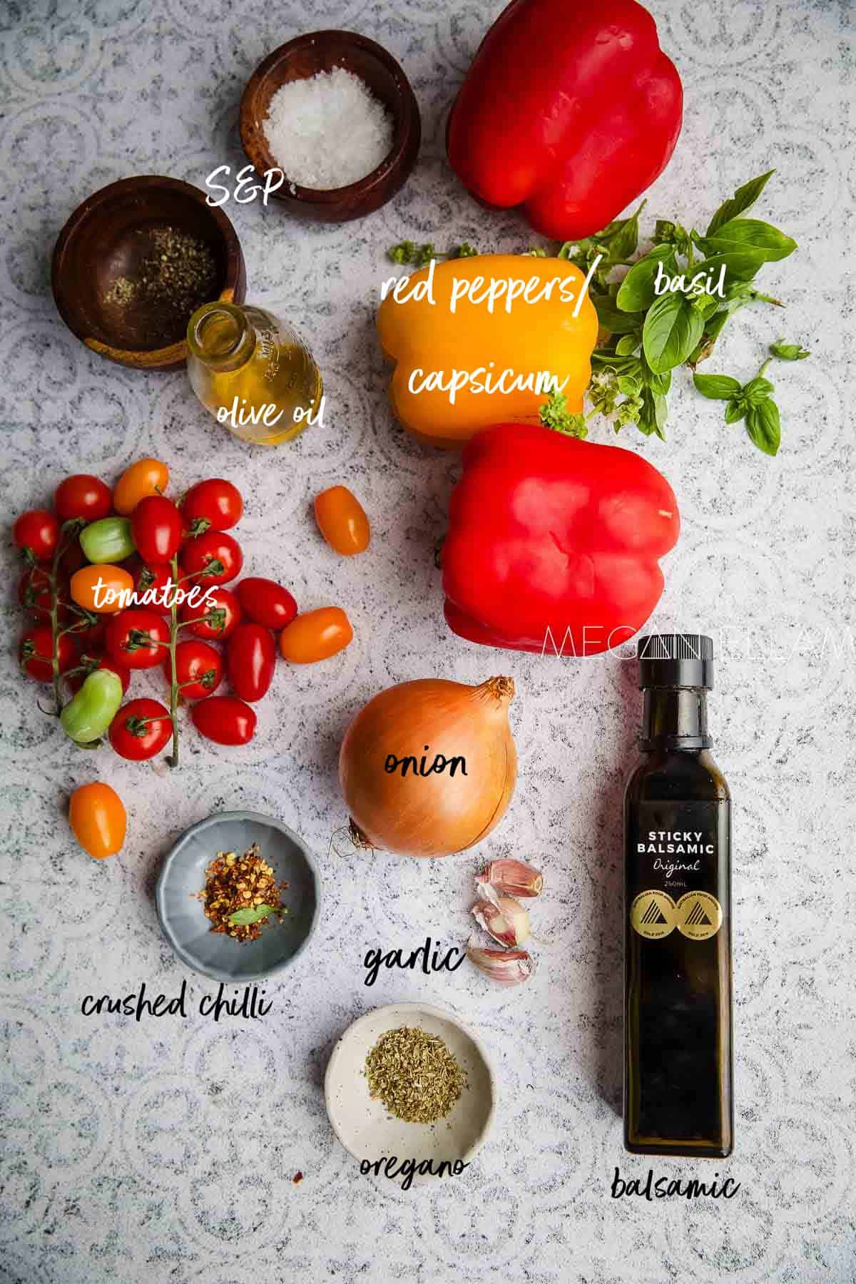 Peperonata recipe ingredients laid out on a tiled background with labels.