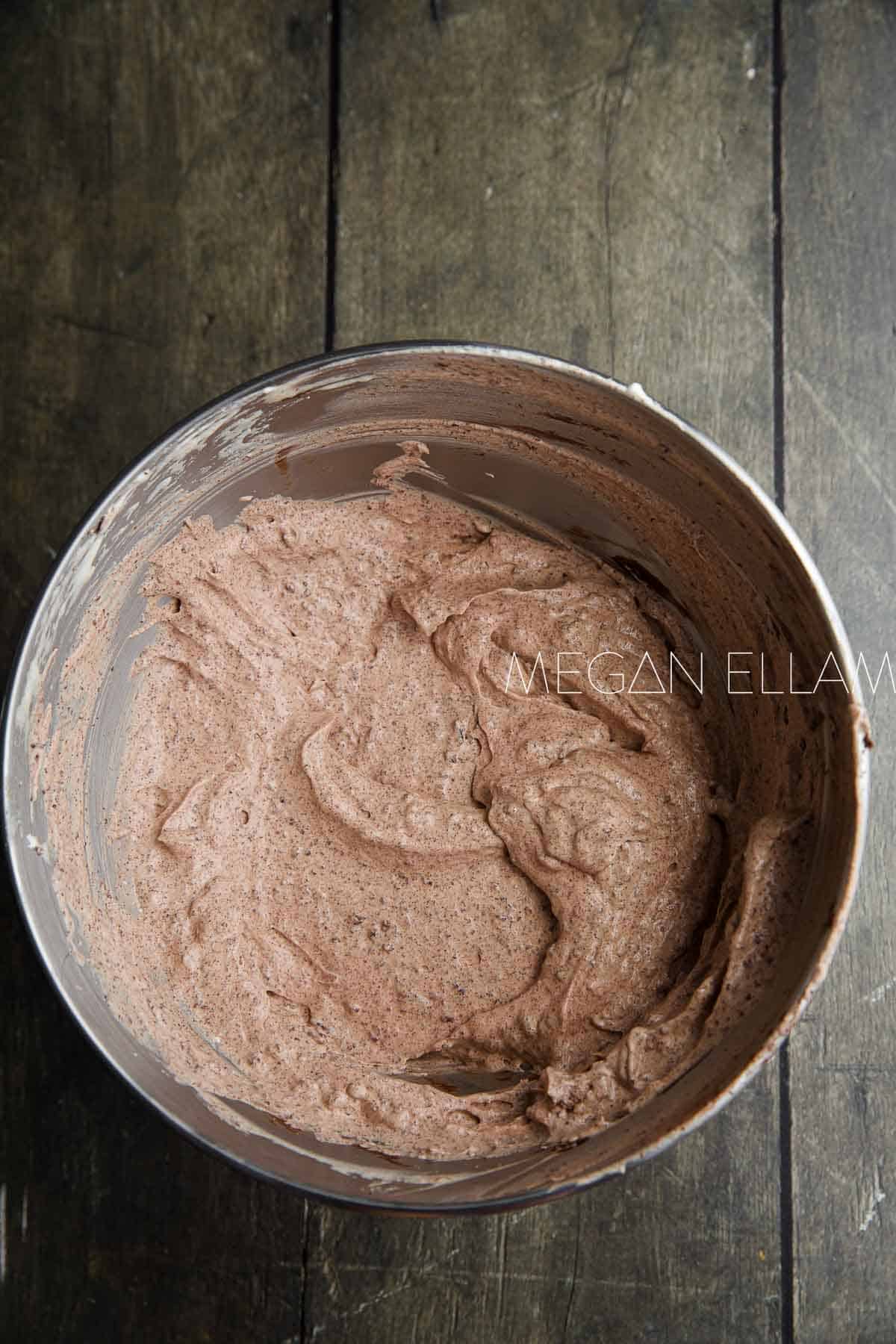 Folded chocolate mousse in mixer bowl.